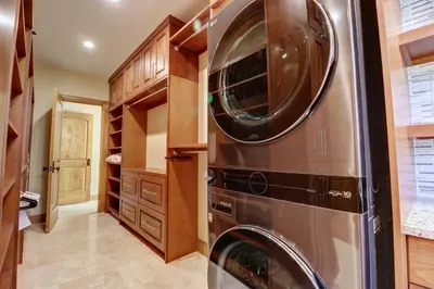 a kitchen with a stainless steel washer and dryer at Peakside Escape 178 home in Silverthorne