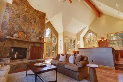 a living room with a couch and a fireplace at Peakside Escape 178 home in Silverthorne
