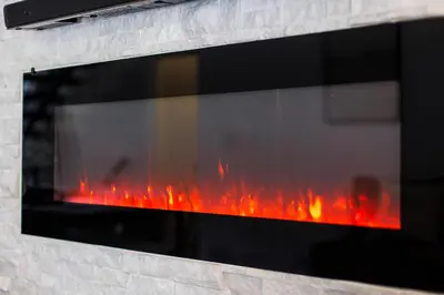 a fireplace with red flames in it at Lux Newly Remodeled DT, Patio, Fully Stocked 5Bd, 3Ba in Denver