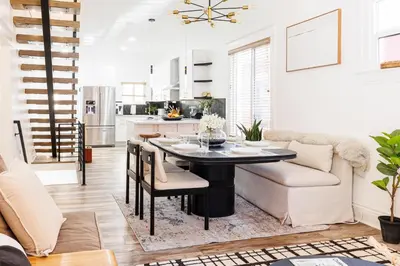 a kitchen and living room with a table and a couch at Lux Newly Remodeled DT, Patio, Fully Stocked 5Bd, 3Ba in Denver