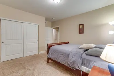 a bedroom with a bed and a closet at 6 Mi to DIA Spacious Home with Backyard in Denver! in Aurora