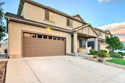 a large house with a garage at 6 Mi to DIA Spacious Home with Backyard in Denver! in Aurora