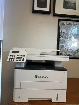 a fax machine sitting on top of a printer at Eco-Friendly Sunnyside 3 Bedroom Bungalow in Denver