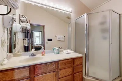 a bathroom with a sink and a shower at Mountainside 120 in Granby