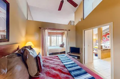 a bedroom with a large bed and a window at Mountainside 037 in Granby