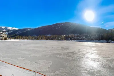 an ice hockey rink with the sun in the background at Lakefront Keystone Studio in Keystone