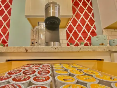 a counter with containers of food on a table at More than 100 years modern house, 3 rooms whit kids playground in Longmont