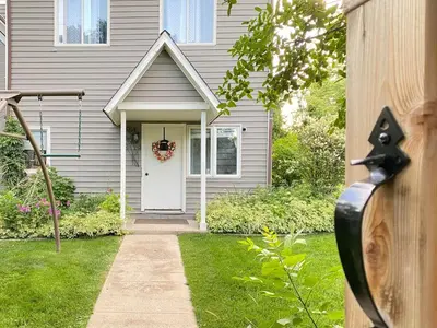 a house with a white door with areath on it at More than 100 years modern house, 3 rooms whit kids playground in Longmont