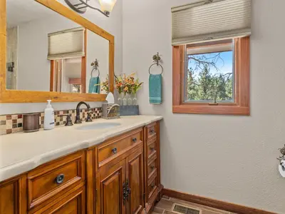 a bathroom with a sink and a mirror at 1k Pine Knolls - Estes in Estes Park