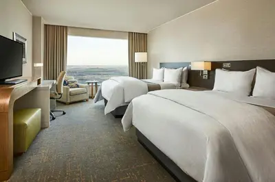 a hotel room with two beds and a television at The Westin Denver International Airport in Denver