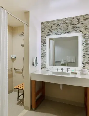 a bathroom with a sink and a mirror at The Westin Denver International Airport in Denver
