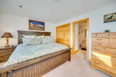 a bedroom with a large bed and a dresser at 6 Mi to Keystone Resort Dillon Condo with Balcony in Dillon