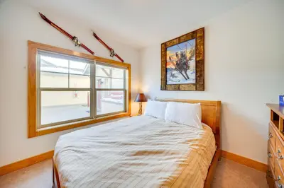 a bedroom with a bed and a window at 6 Mi to Keystone Resort Dillon Condo with Balcony in Dillon