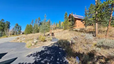 an empty road in front of a house at Palmers Dr 1010 in Silverthorne