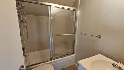 a bathroom with a shower and a toilet and a sink at Palmers Dr 1010 in Silverthorne