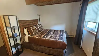 a bedroom with a bed and a window at Palmers Dr 1010 in Silverthorne
