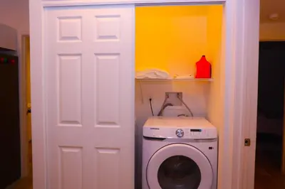 a washer and dryer in a small room at Cozy Home near Gaylord Rockies Resort & Denver Airport in Aurora