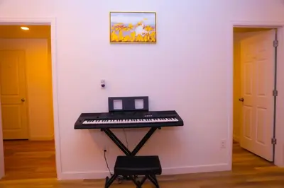 a keyboard sitting on a table in a room at Cozy Home near Gaylord Rockies Resort & Denver Airport in Aurora
