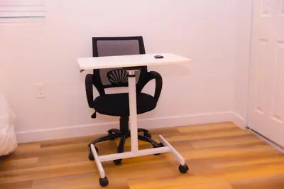 a white desk with a black chair under it at Cozy Home near Gaylord Rockies Resort & Denver Airport in Aurora
