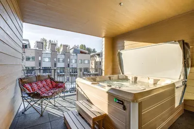 a balcony with a sink and a chair at Walk to Cooper Creek Square Condo with Hot Tub! in Winter Park