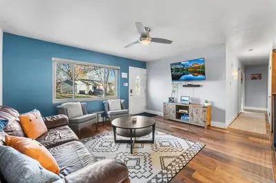 a living room with a couch and a table at Creekside Family Haven in Arvada
