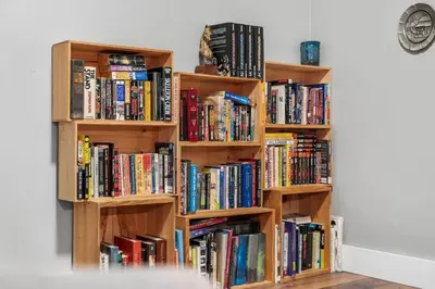 a book shelf filled with lots of books at Creekside Family Haven in Arvada