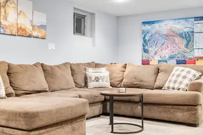 a living room with a couch and a table at Creekside Family Haven in Arvada