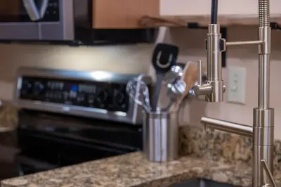 a kitchen counter with a container of kitchen utensils at Premium Unit 2216 - 1 Br - Zephyr Mountain Lodge condo in Winter Park