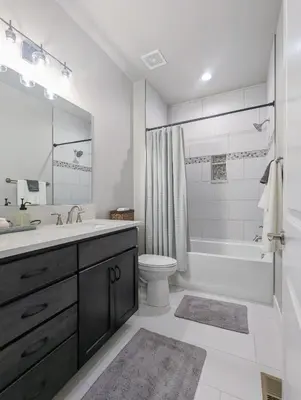 a bathroom with a sink and a tub and a toilet at Lovely Townhome at the TPC Golf Course in Berthoud