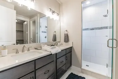 a bathroom with a sink and a shower at Lovely Townhome at the TPC Golf Course in Berthoud