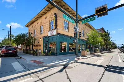 a building on a street corner with a traffic light at Broadway Dog-Friendly Loft with Parking in Denver