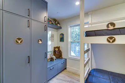 a kids bedroom with a bunk bed and a ladder at Mtn Escape with Hot Tub, By Trails in Grand Lake! in Grand Lake
