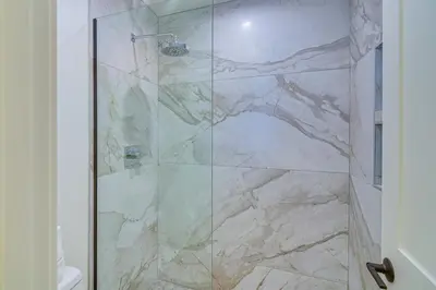 a shower with a glass door in a bathroom at Mtn Escape with Hot Tub, By Trails in Grand Lake! in Grand Lake