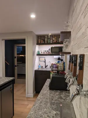 a kitchen with a sink and a counter top at Cliff's Edge Brewing BBnB in Denver