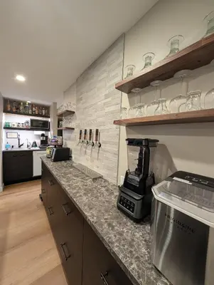 a kitchen with a counter with a coffee maker on it at Cliff's Edge Brewing BBnB in Denver