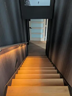 a staircase in a building with wooden floors at Cliff's Edge Brewing BBnB in Denver