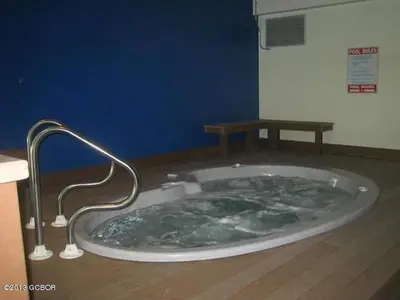 a jacuzzi tub with a metal faucet in a bathroom at Best Ski Condo, Winter Park, USA in Winter Park