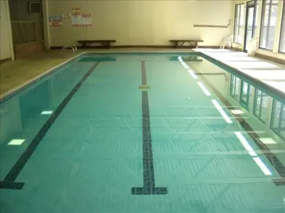 a swimming pool with a cross on the water at Best Ski Condo, Winter Park, USA in Winter Park