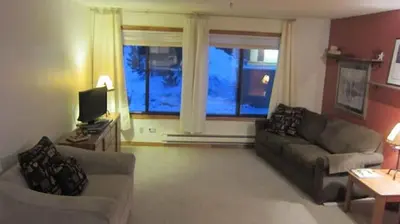 a living room with two couches and a television at Best Ski Condo, Winter Park, USA in Winter Park