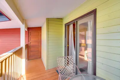 a colorful house with a balcony with a door at Pool and Hot Tub Access Condo in Winter Park! in Winter Park