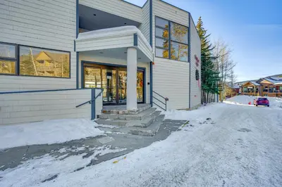 a house on a street with snow on the ground at Steps to River Run Gondola Ski Condo with Views! in Keystone