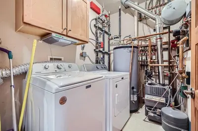 a washer and dryer in a laundry room at 6 Cabin in the Pines home in Keystone