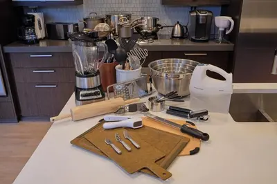 a kitchen counter with a blender and a cutting board at Denver Lower Highlands Modern Home in Denver