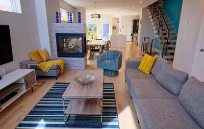 a living room with a couch and a table at Denver Lower Highlands Modern Home in Denver
