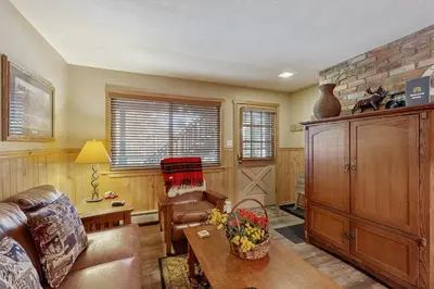 a living room with a couch and a table at Hi Country Haus 11-12 in Winter Park