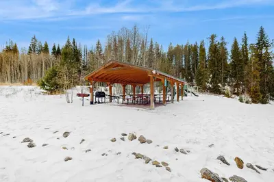 a wooden pavilion in the snow on a beach at Hi Country Haus 11-12 in Winter Park