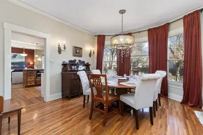 a dining room with a table and chairs at City Park Charm - Vintage Home with Modern Comforts in Fort Collins