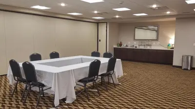a conference room with a white table and chairs at Holiday Inn Express & Suites Golden by IHG in Golden