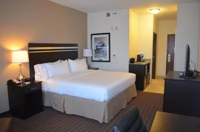 a hotel room with a bed and a television at Holiday Inn Express & Suites Golden by IHG in Golden