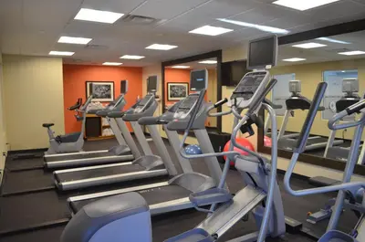 a gym with treadmills and cardio machines at Holiday Inn Express & Suites Golden by IHG in Golden